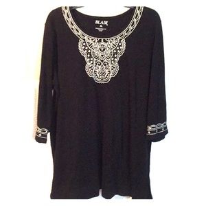 Beautiful Blair tunic top with white embroidery.